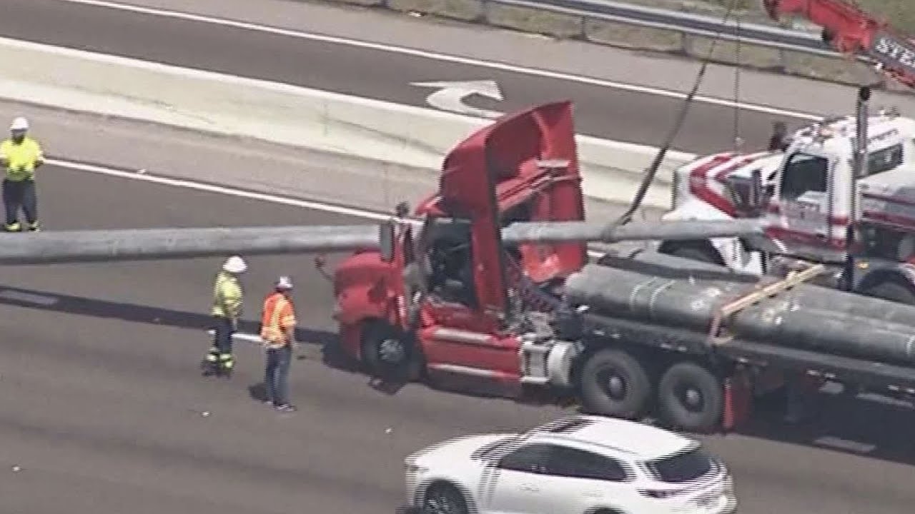 Poles Crash Through Semi Truck's Windshield In Tampa Shutting Down Highway